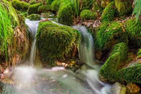 Blurred image of a small river waterfall close-up long exposure Foto stock