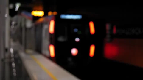 A blurred image of a subway train leaving the station, a half-empty subway car. Stock Footage 311797172