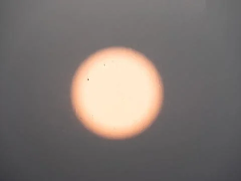 Blurred image of the sun at sunset. Stock Photos