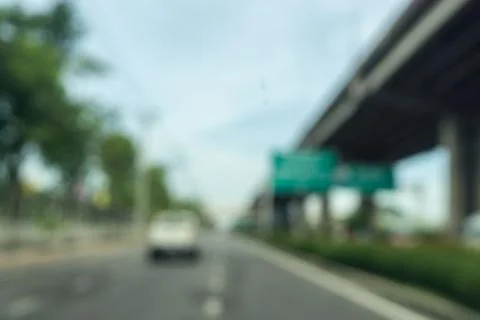Blurred image traffic on the road from inside car bangkok thailand., Stock Photos