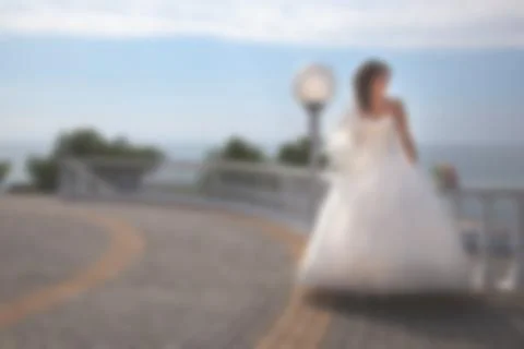 Blurred image of a wedding theme on the beach of the embankment of a young co 스톡 사진