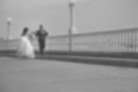 Blurred image of a wedding theme on the beach of the embankment of a young co Stock Photos