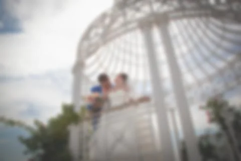 Blurred image of a wedding theme on the beach of the embankment of a young co 스톡 사진