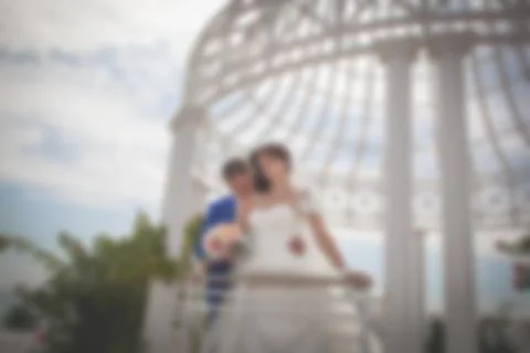 Blurred image of a wedding theme on the beach of the embankment of a young co Stock Photos