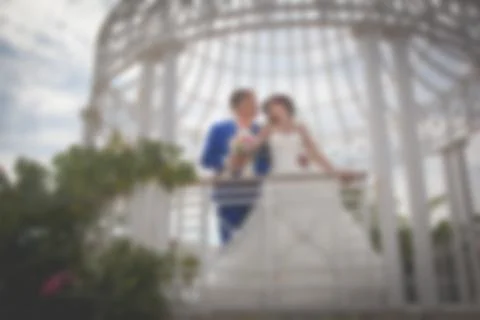 Blurred image of a wedding theme on the beach of the embankment of a young co Stock Photos