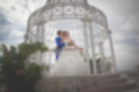 Blurred image of a wedding theme on the beach of the embankment of a young co Stock Photos