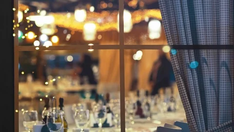 Blurred image in the window of the interior of a large beautiful restaurant Stock Footage 94449766