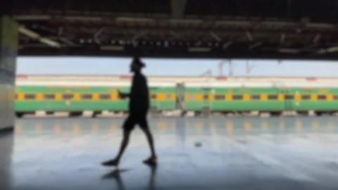 Blurred Indian Railway Station Background with Train on Platform Stock Footage 333622151