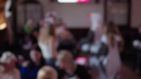 Blurred indoor crowd at lively social gathering with people standing, chatting Stock Footage 337648342