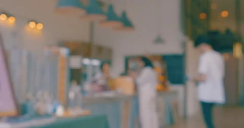 Blurred inside coffee shop with people drinkking Stock Footage 135540180