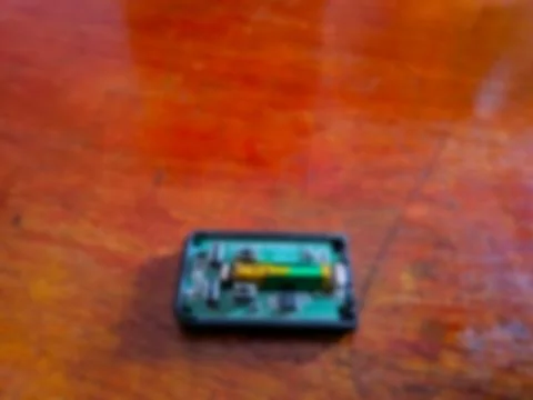 Blurred Inside View of Car Remote Control Circuit Board and Battery Stock Photos