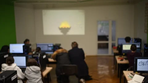 Blurred interior of digital design classroom with students working on compu.. Stock Footage 339643518