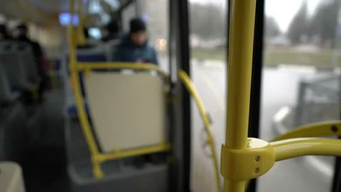 Blurred interior view of an empty bus traveling through the city. People, car Video stock 124467455