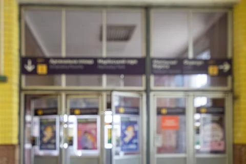 A blurred interior view of an old city train station entrance featuring nav.. Stock Photos