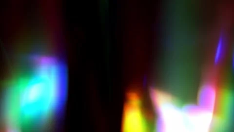 Blurred light waves pulse gently in tones of green, orange, and red. Abstract Video stock 321267347