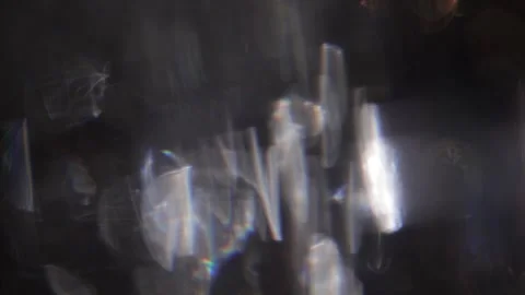 Blurred lights background with sparkling crystal lights overlay on black Video stock 318575516
