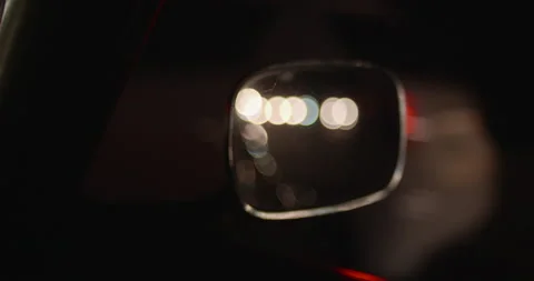 BLURRED LIGHTS BEHIND CAR IN WING MIRROR - NIGHTTIME DRIVING Stock-Footage 141203857