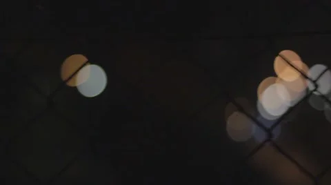 Blurred Lights behind a Fence Stock Footage 53255027