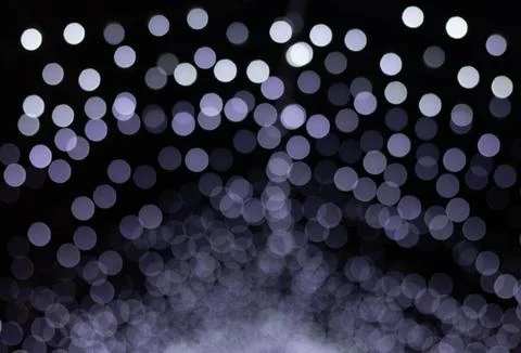 Blurred lights with a bokeh effect create a soothing purple ambiance Stock Photos