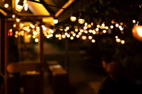 Blurred lights of cafe in the evening Stock Photos