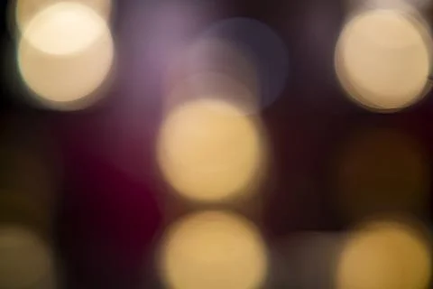 Blurred lights create a dreamy atmosphere in an evening celebration setting Stock Photos