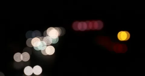 Blurred lights of headlights moving night traffic out of focus backlight Stock Footage 242779188