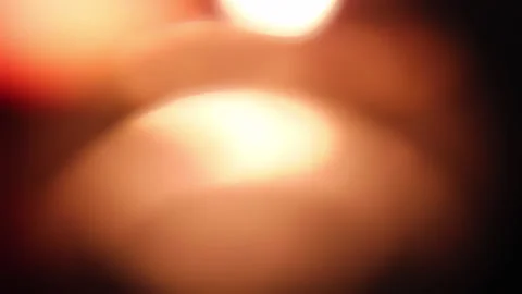 Blurred lights of rotating cigarette lighter Stock Footage 130586065