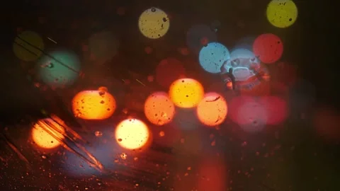 Blurred Lights Seen from Inside a Car at Night While It Rains 動画素材 295143781