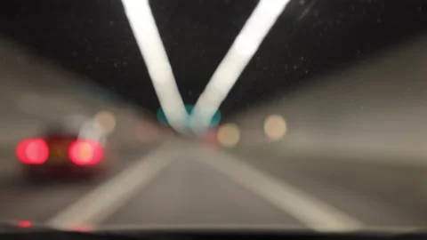 Blurred lines of ceiling and traffic nights in tunnel as seen from Car Stock Footage 158098257
