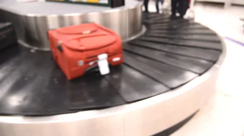 Blurred luggage passing by while on baggage carousel Stock Footage 57223326