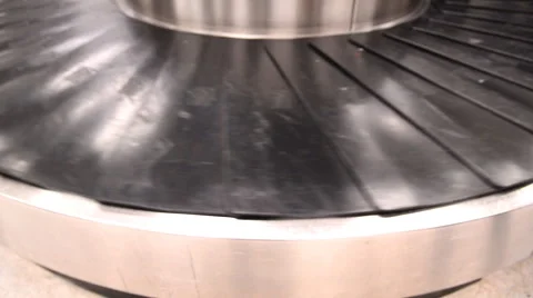 Blurred luggage passing by while on baggage carousel Stock-Footage 57223939