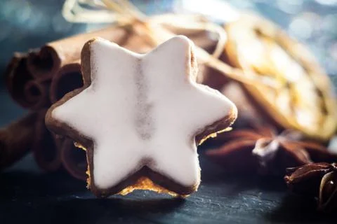 Blurred macro cookie star and dry orange Stock Photos