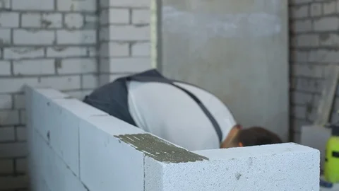 Blurred male builder working at construction site Stock Footage 102558080