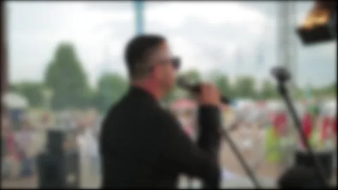A Blurred Male Singer With Sunglasses Performs At An Outdoor Festival. A Stock Footage 329621100