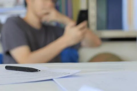 Blurred man reading message on smartphone Stock Photos