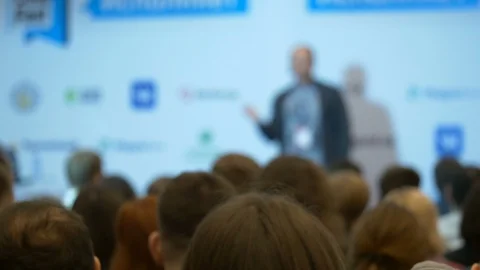 Blurred man showing screen and speech at business education conference at forum Stock Footage 88591175