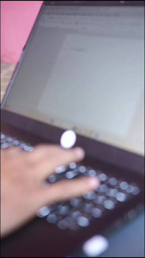 Blurred A man is typing on a laptop computer. The laptop is open Stock Footage 322116054