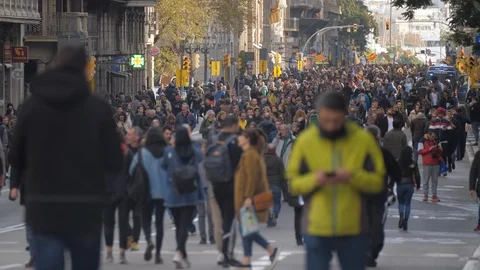 Blurred man walking and Checking the mobile. With a crowd of people behind Stock Footage 106726977