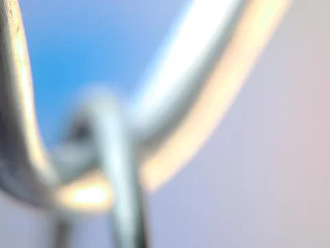 Blurred metallic chain link evokes connection, strength, and an abstract vi.. Stock Photos
