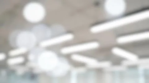 Blurred modern bright office ceiling lighting abstract texture featuring ge.. Stock Photos
