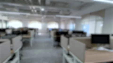 Blurred Modern Corporate Office Workspace with Open Plan Desks and Computers Stock Footage 338321308