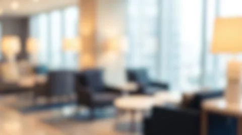 Blurred modern luxury hotel lobby interior featuring comfortable armchairs .. Фото
