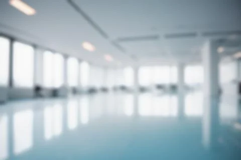 Blurred modern office interior, empty corporate workspace, blue tinted busi.. Stock Photos