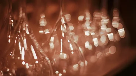 Blurred motion of inverted wine glasses with bokeh lights creating a warm, .. Stock Footage 339639991