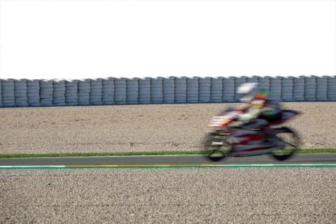 Blurred motion of moborbike competing in racing circuit and white space Stock Photos