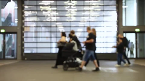 Blurred motion of people walking at a trade fair. Crowd of anonymous people.. Stock Footage 337463742