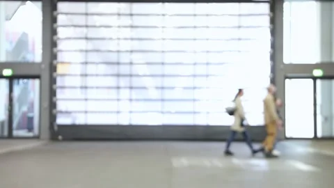 Blurred motion of people walking at a trade fair. Stock Footage 340209049