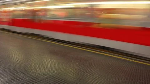 Blurred motion red subway train metro station Stock Photos