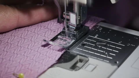 Blurred motion of sewing machine needle stitching fabric Stock Footage 344382205