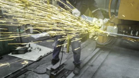 Blurred motion of technician are cutting pipe, Electricity spark from chainsa Stock Photos
